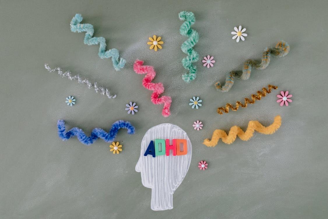 ADHD concept image – drawing of head silhouette surrounded by sparks and squiggles ADHD concept image - drawing of head silhouette surrounded by sparks and squiggles